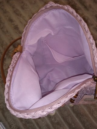 Bolso redondo tejido con abalorios