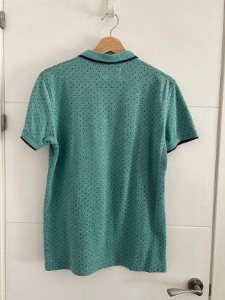 Polo Sfera verde con puntos