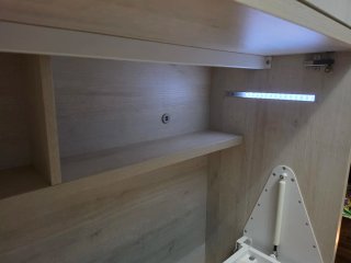 Cama abatible con armario superior