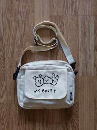Bolso de tela beige con dibujo