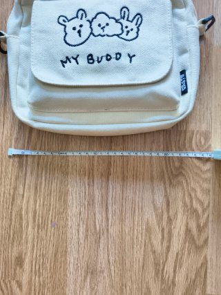 Bolso de tela beige con dibujo