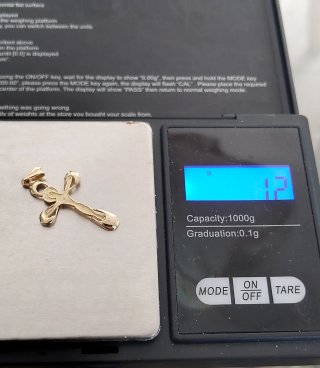 Cruz de oro 18k 1.2gr
