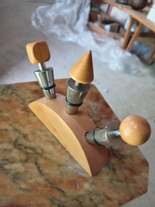 Tappi per bottiglie in acciaio e legno