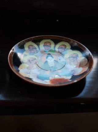 Taza y plato antiguo decorado