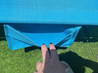 Tumbona plegable azul turquesa con  cojin y asas