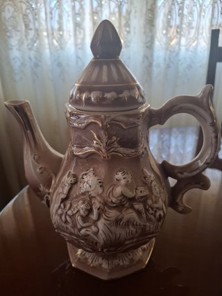 Juego de café de cerámica con figuras
