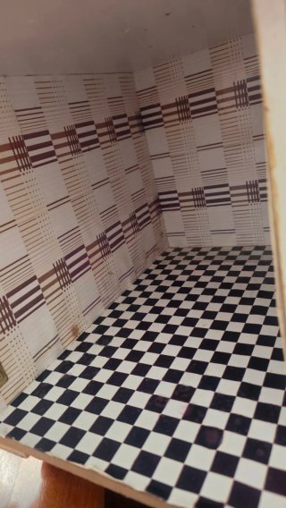 Casa de muñecas de madera.