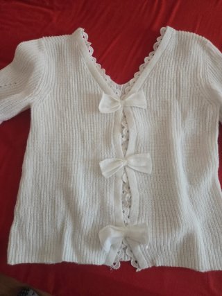 Jersey de lana blanco con lazos