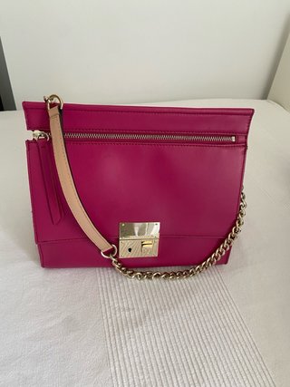 Bolso de piel rosa y dorado