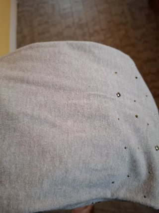 Vestito grigio con collo alto e strass