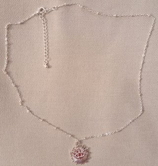 Collana con ciondolo occhio sole argento