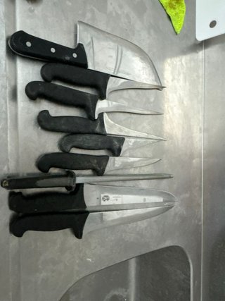 Set di 7 coltelli da cucina con manico nero