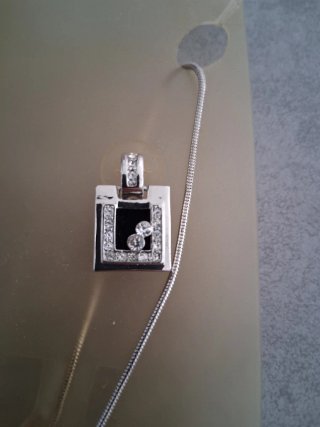 Conjunto plateado con circonitas
