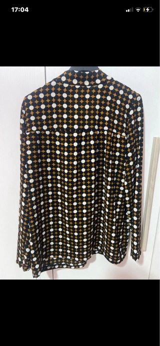 Camicia con fiocco e fantasia geometrica