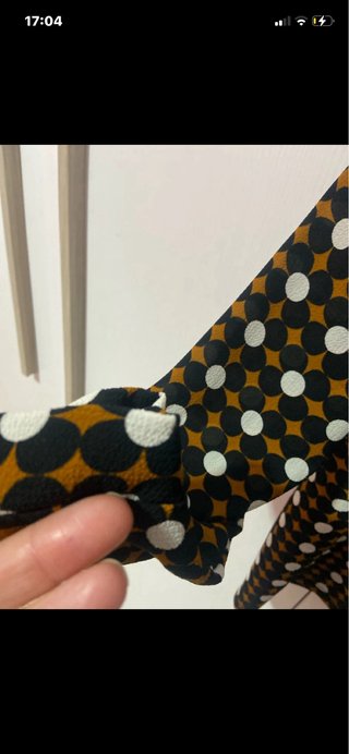 Camicia con fiocco e fantasia geometrica