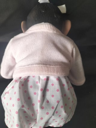 Mona de silicona bebé con vestido rosa