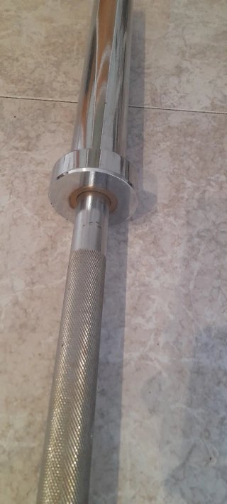 Barra olímpica con discos engomados