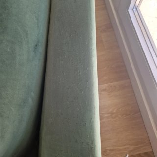 Sofá de terciopelo verde