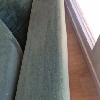Sofá de terciopelo verde