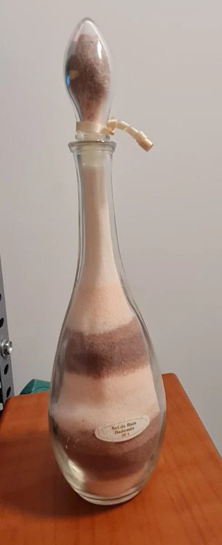 Botella de cristal decorativa con arena