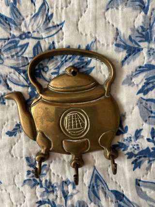 Colgador de metal estilo tetera