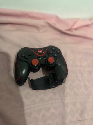 Mando de videojuegos con soporte para móvil