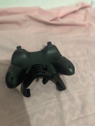 Mando de videojuegos con soporte para móvil
