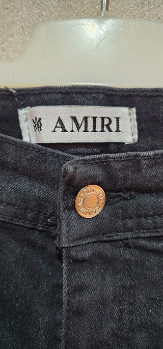 Pantalones Amiri negros con detalles rosas unisex