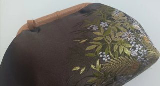 Clutch in tessuto luci con stampa floreale, fodera