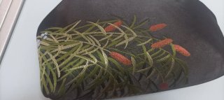 Clutch in tessuto luci con stampa floreale, fodera