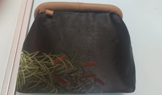 Clutch in tessuto luci con stampa floreale, fodera