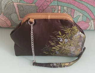 Clutch in tessuto luci con stampa floreale, fodera