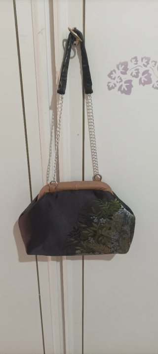 Clutch in tessuto luci con stampa floreale, fodera