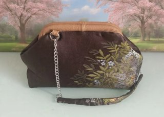 Clutch in tessuto luci con stampa floreale, fodera