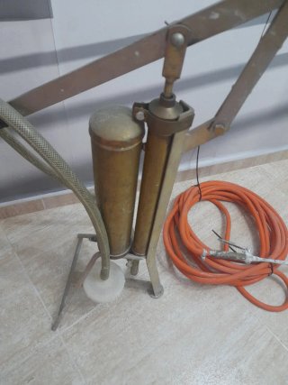 Encaladora antigua con manguera