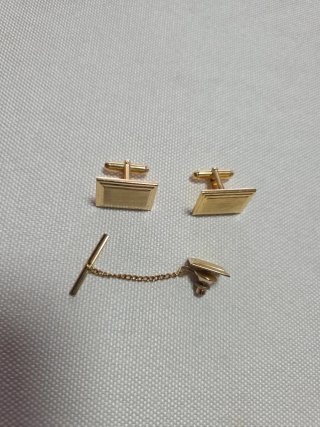 Pisa corbatas y gemelos dorados