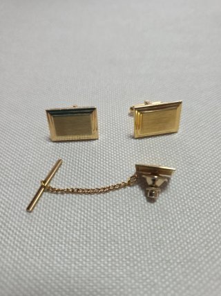 Pisa corbatas y gemelos dorados