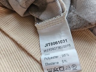 Jersey de pico con rombos beige y marrón