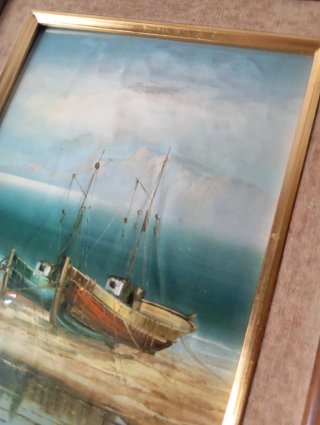Cuadro de barcos en la playa