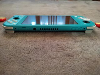 Nintendo Switch Lite + cargador, funda y caja