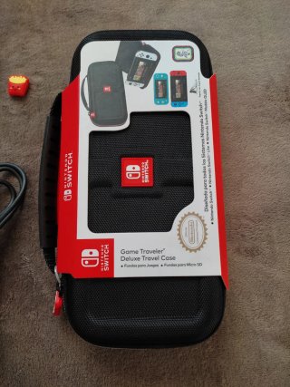Nintendo Switch Lite + cargador, funda y caja