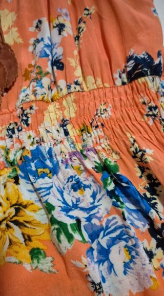 Vestido floral naranja con lazo