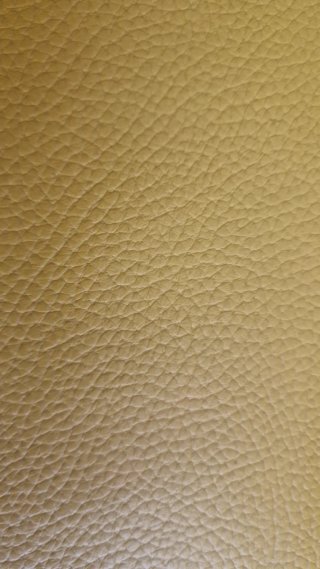 Sofá modular de piel color mostaza