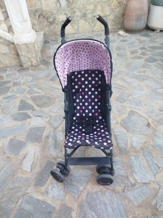Carro de bebé rosa y negro