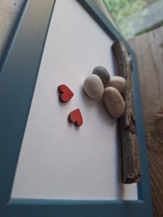 Quadro pebble art fatto a mano.