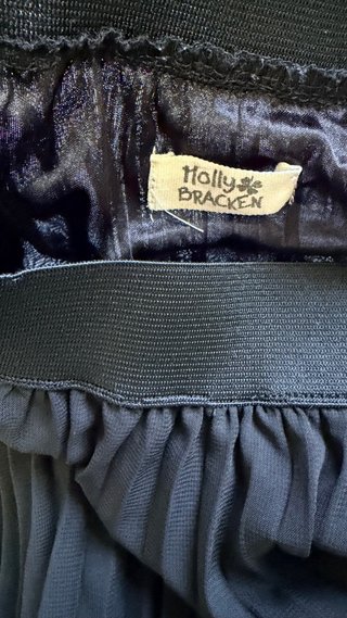 Falda negra Plisada Asimétrica Molly Bracken