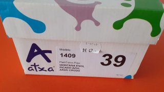 Zapatos planos negros con lazo blanco