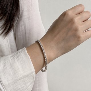 Pulsera elástica con pedrería plateada