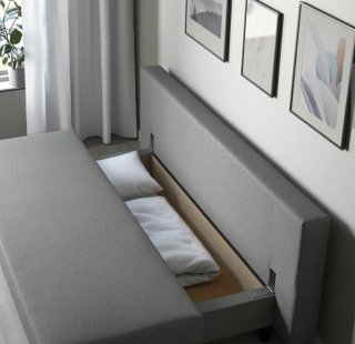 Sofá cama gris de tela