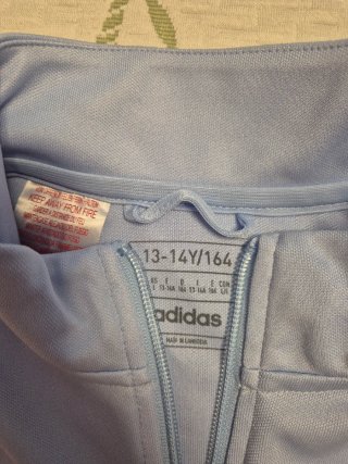Chandal Oficial Real Madrid Adidas Azul Naranja.